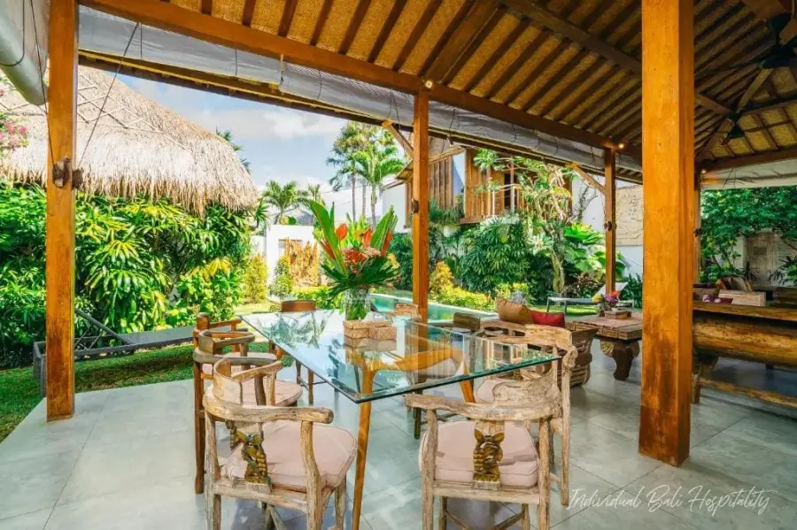 The long table set beside the pool