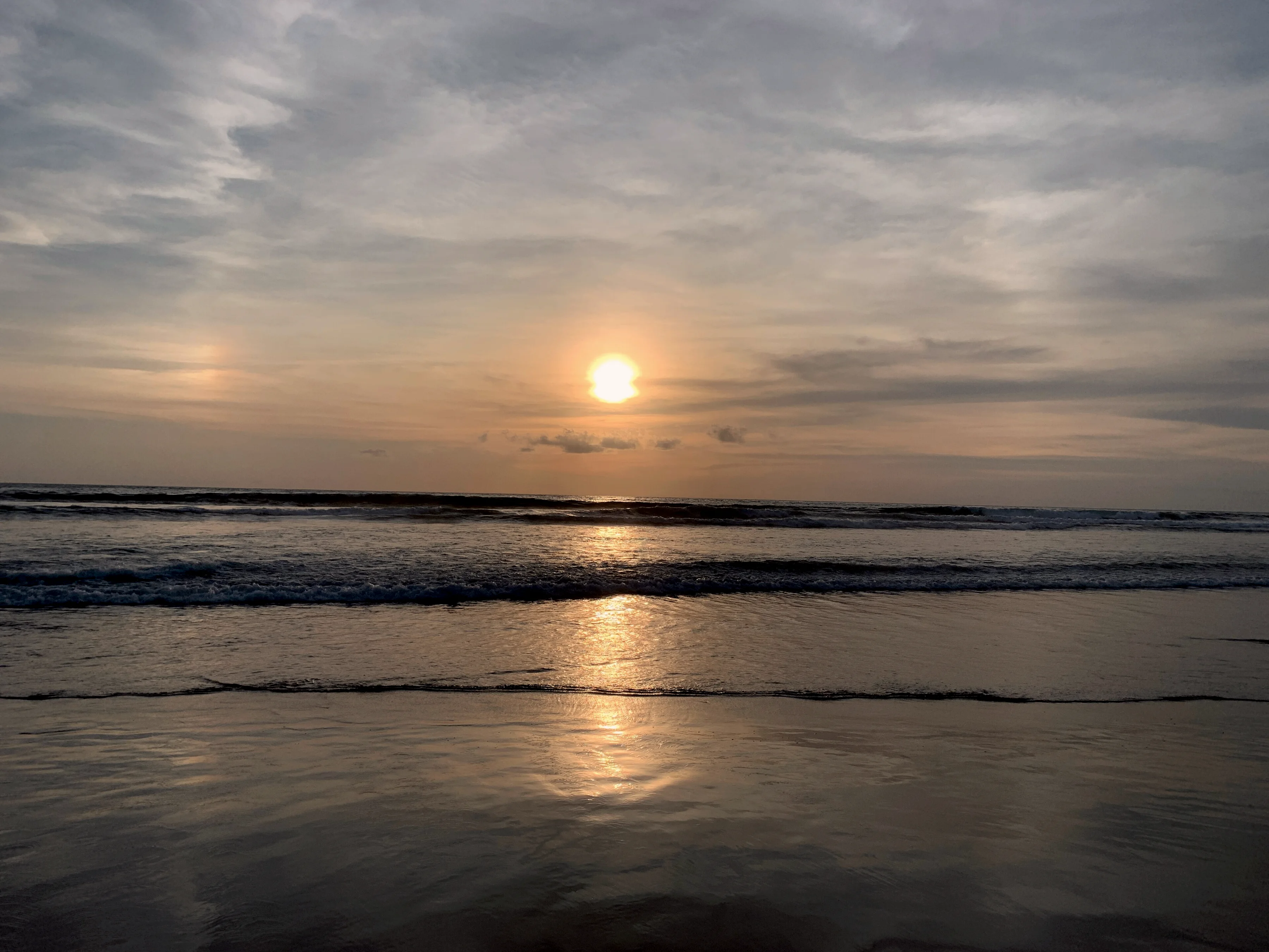 Sunset over the sea at Double Six beach