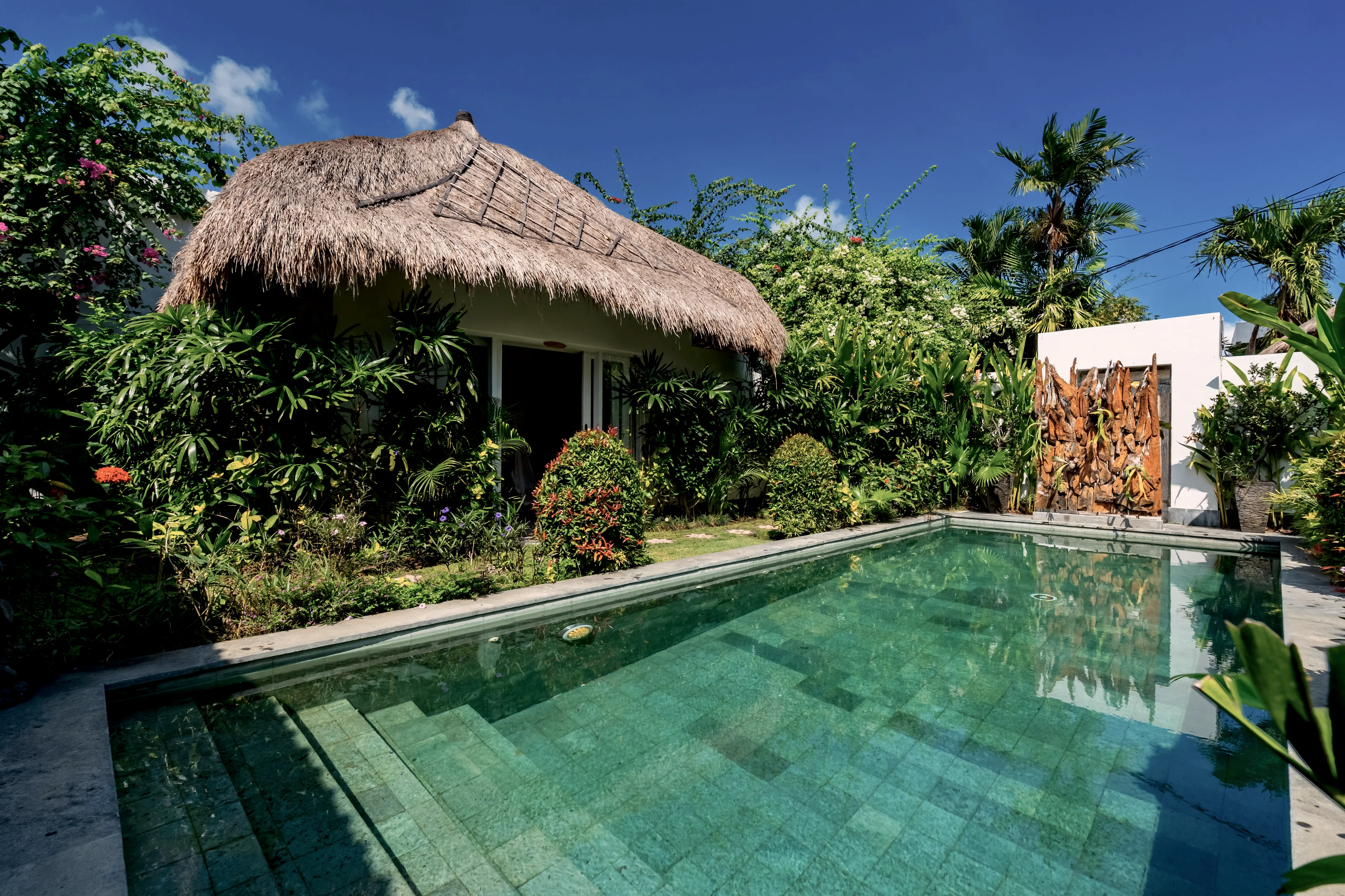 The pool from the far end, the round thatched bale to one side