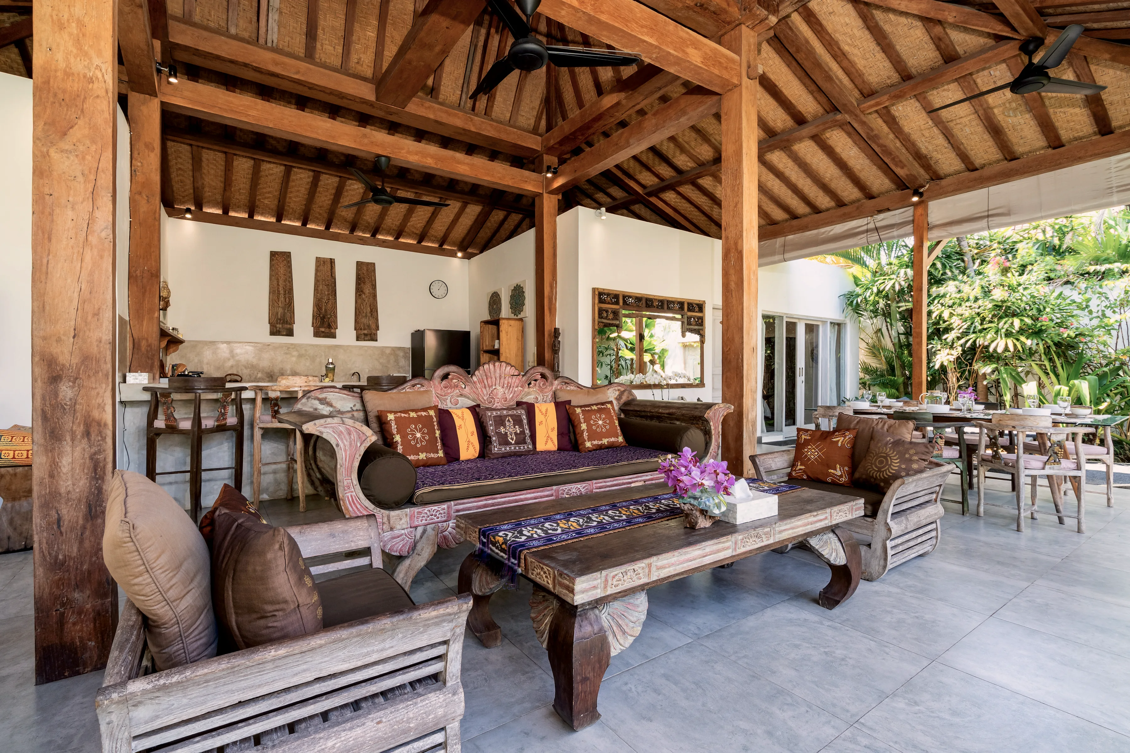 The pavilion from the lounge: daybeds, the long table and the kitchen beyond